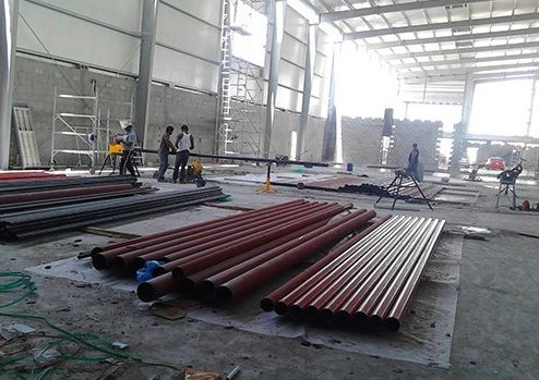 Steel pipes stored on a construction site
