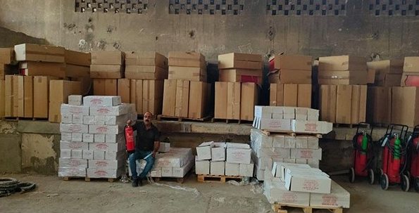 Boxed fire protection equipment in a warehouse